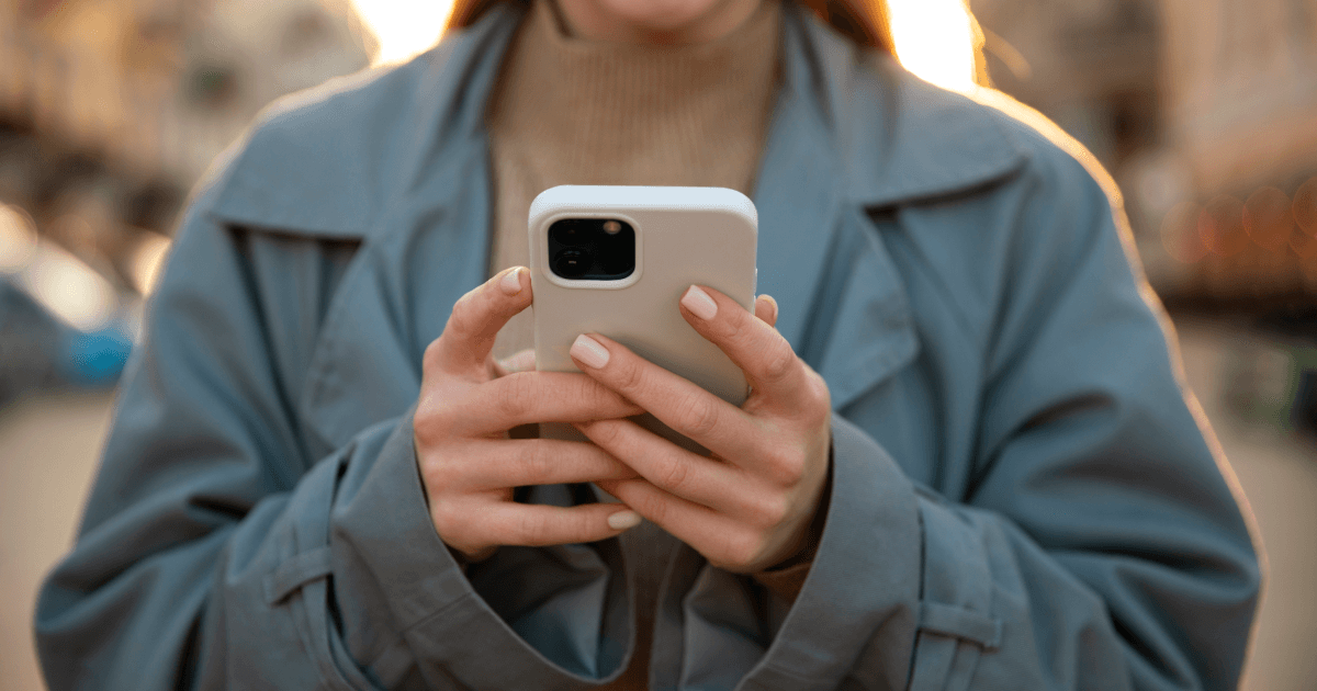 Girl holding an iPhone.