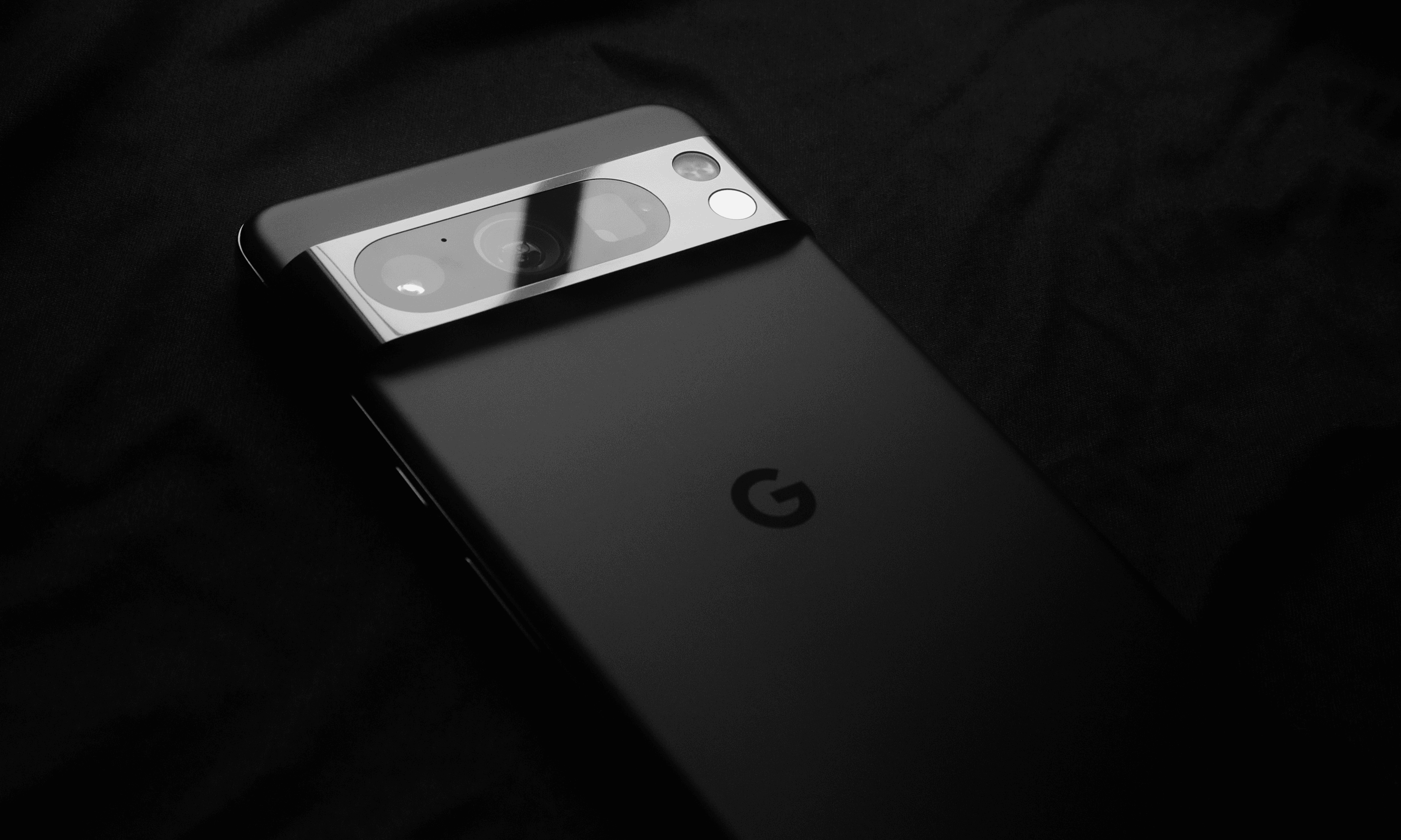 google pixel phones on a green background with downwards arrows