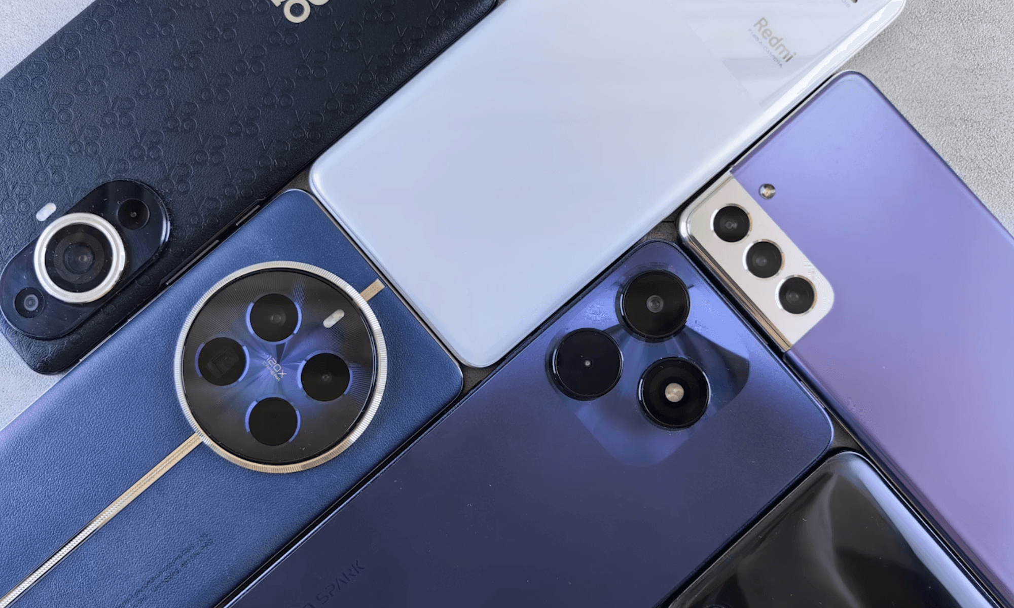 Close-up shot of smartphones placed together face down.