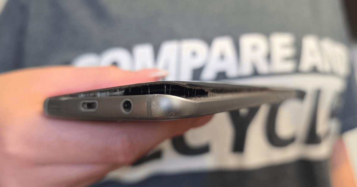 a micro shot of a phone's back panel lifting off because of a swollen lithium ion battery